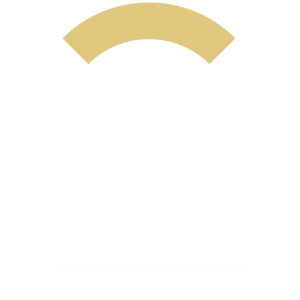 A small, centered, light tan arch-shaped icon on a solid white background.